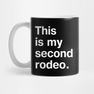 "This is my second rodeo." in plain white letters - cos you're not the noob, but barely Mug